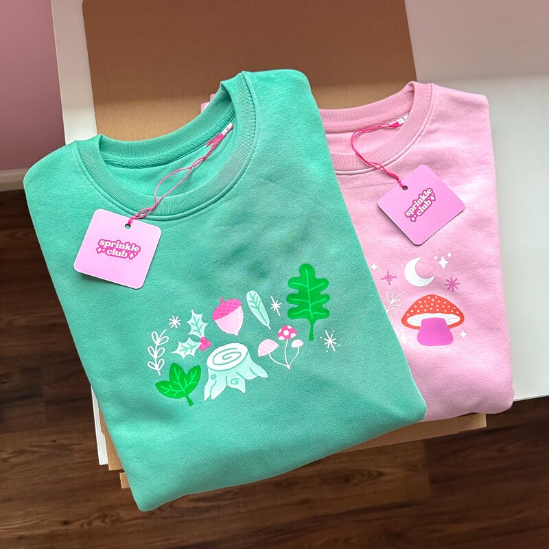 Sprinkle Club - A cute collection of two pastel pink and green sweatshirts with cute forest designs