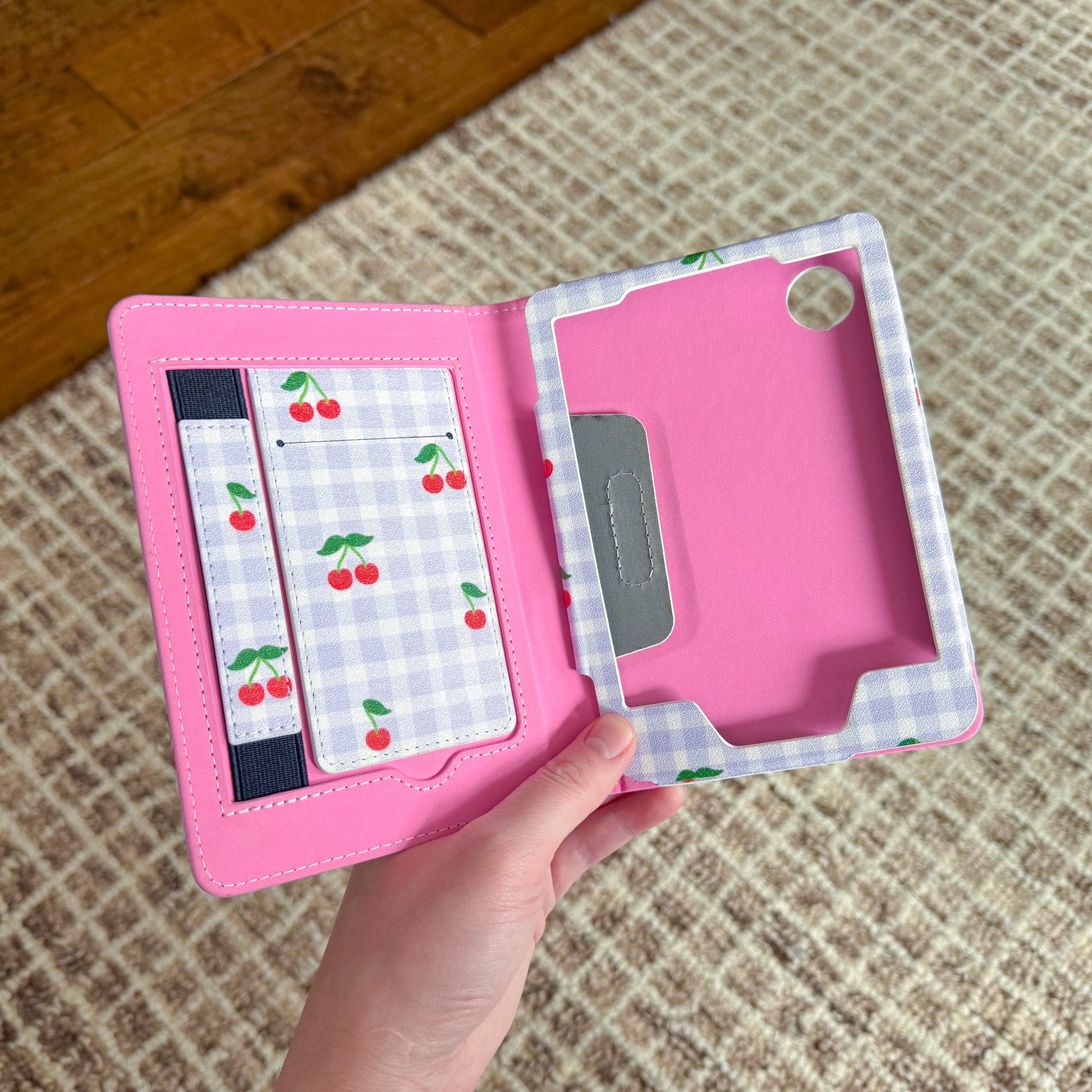Sprinkle Club - Open pink Kobo Clara case with cherry gingham interior and hand strap
