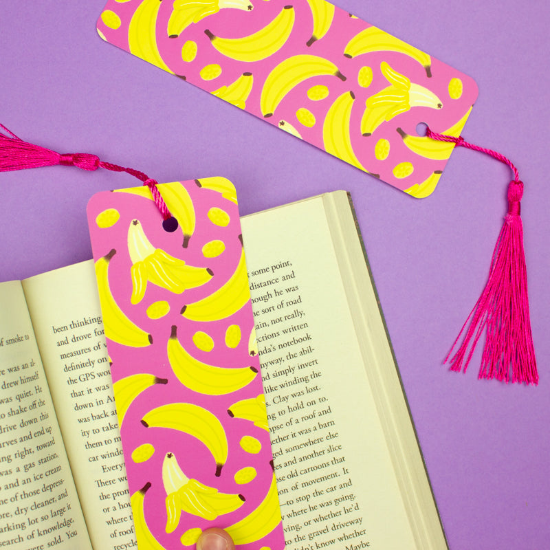 Sprinkle Club - A bright pink bookmark with yellow banana print and a pink tassel