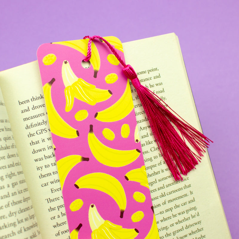 Sprinkle Club - A bright pink bookmark with yellow banana print and a pink tassel