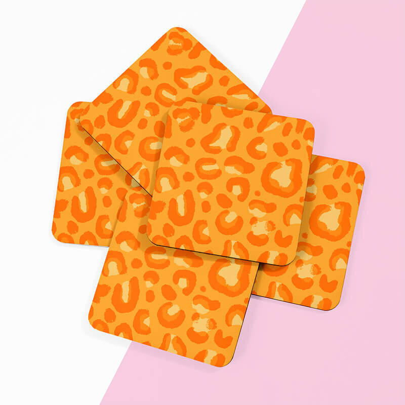 Sprinkle Club - A matching set of orange leopard print drinks coasters for your dining table