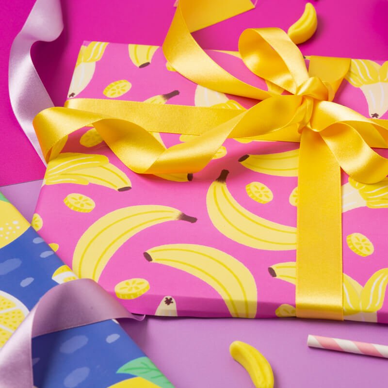 Sprinkle Club - A wrapping present in pink and yellow wrapping paper