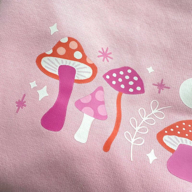 Sprinkle Club - A pink and red mushroom design on a sweatshirt that has witch vibes
