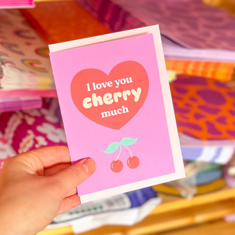 Sprinkle Club - A bright pink and red valentine's card with a love heart saying 'I love you cherry much' and cherries below