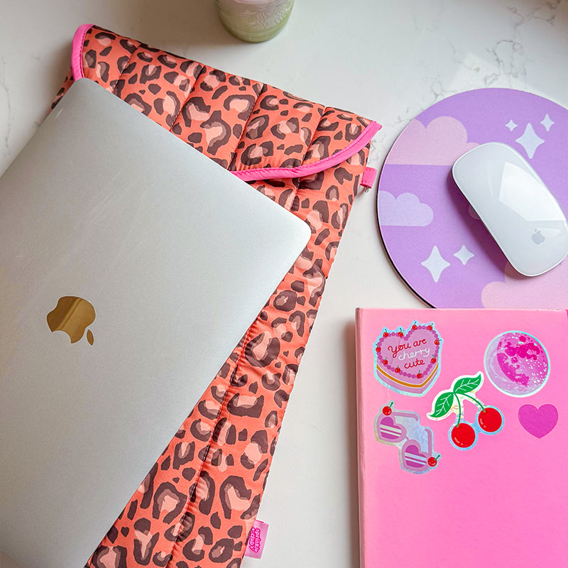 Sprinkle Club - Leopard print quilted laptop sleeve with laptop, pink notebook and mouse on a desk