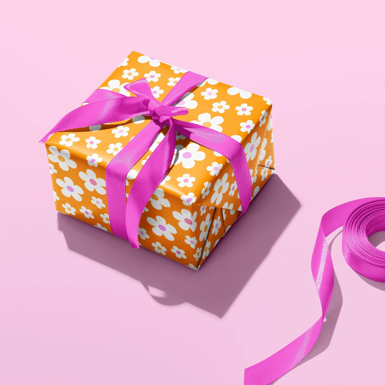 Sprinkle Club - A gift wrapped in daisy wrapping paper and pink ribbon