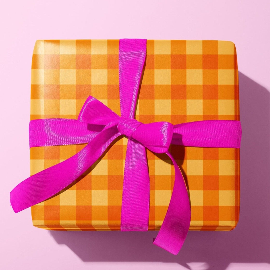 Sprinkle Club - A gift wrapped in a cute orange gingham pattern wrapping paper and pink ribbon