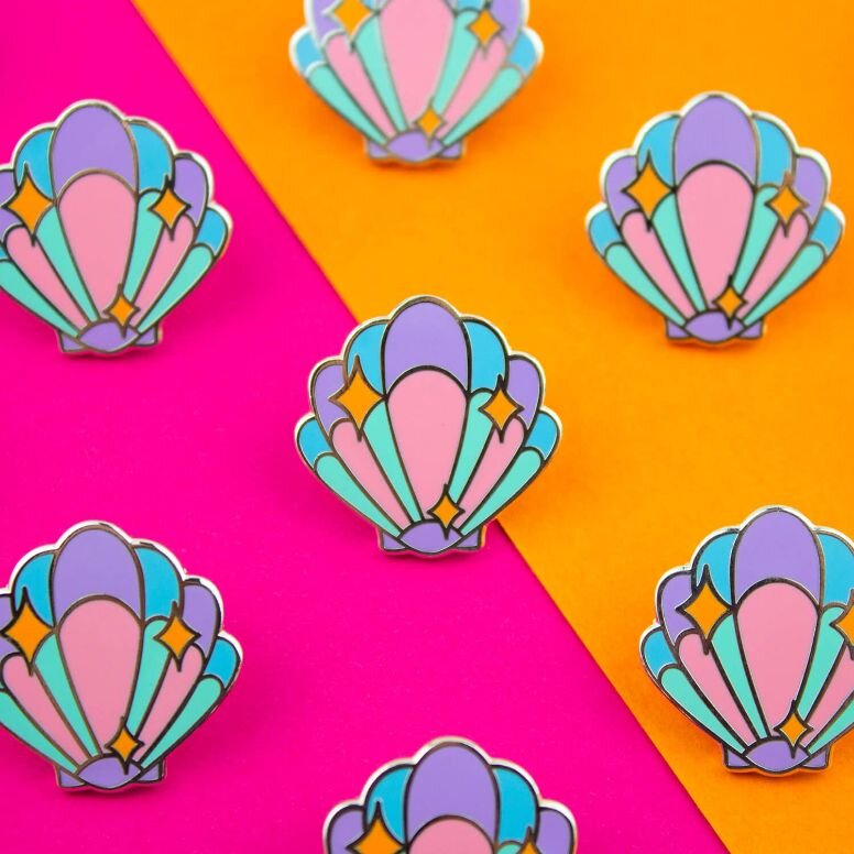 Sprinkle Club - Cute pastel mermaid shell enamel pin with orange sparkles